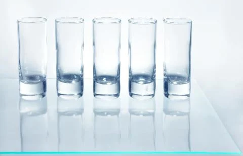 A row of glasses for vodka Stock Photos