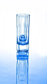 A row of glasses for vodka Stock Photos