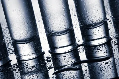 Row of glasses for vodka Stock Photos