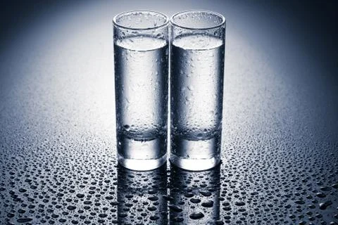 Row of glasses for vodka Stock Photos