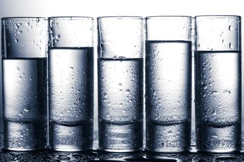 Row of glasses for vodka Foto stock