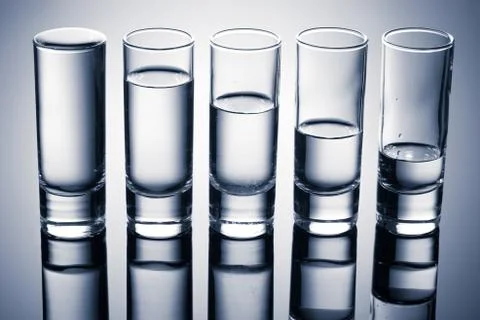 Row of glasses for vodka Stock Photos