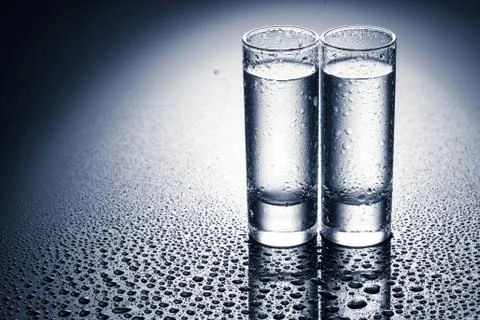 Row of glasses for vodka Stock Photos