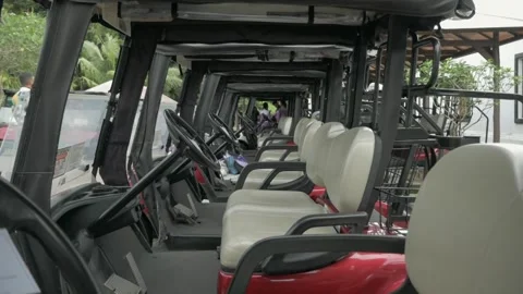 Row of golf car buggy dolly out Stock Footage 260382484