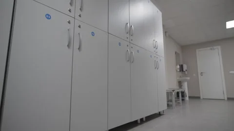 Row of grey numbered lockers with locks shines glossy Stock Footage 318736698