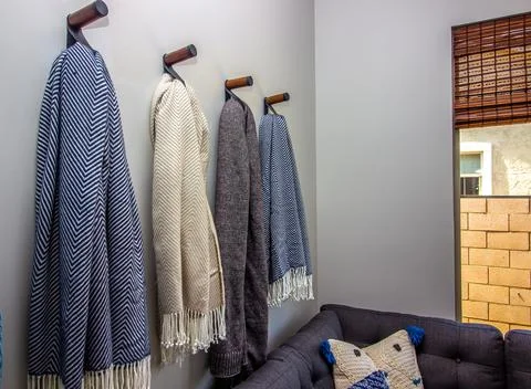 Row Of Hanging Couch Throws Stock Photos