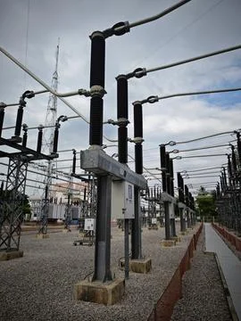 Row of high voltage electrical circuit breaker switchgear equipment . Stock Photos