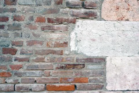 Row of hooks for clothes on the brick wall Stock Photos