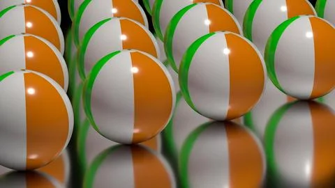 Row of inflatable beach balls on reflective green surface perspective Illustrazione stock