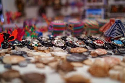 Row of inlaid abalone shell turtle figurines in selective focus 写真素材