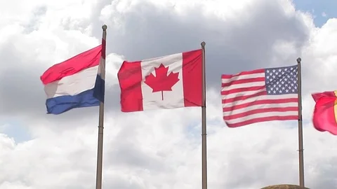 Row of International flags on Juno Beach, Normandy France Stock Footage 83102804