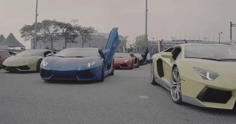 Row of Lamborghinis with doors up 2 Stock Footage 105122592