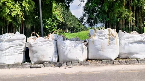 Row of Large White Industrial Jumbo Bags for Construction Material Video stock 331982251