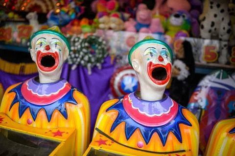 A row of laughing clown faces Stock Photos