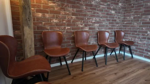 Row of leather chairs in loft space Stock Footage 333073430