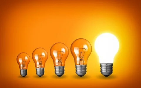 Row of light bulbs.idea concept on orange background. 库存照片
