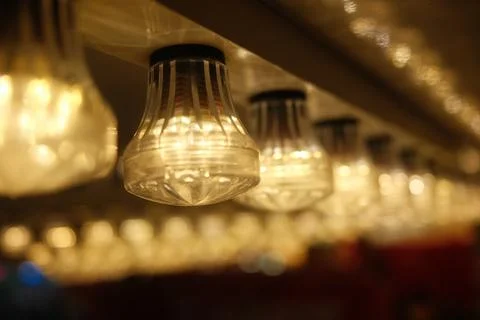 A row of lights with a blurry background Stock Photos