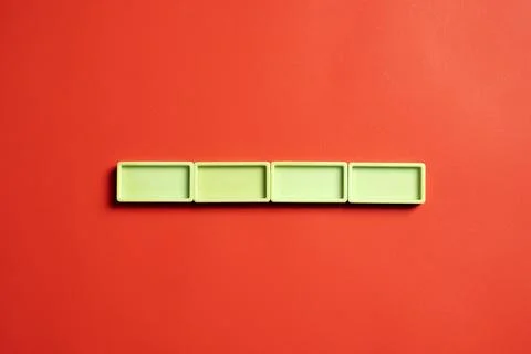 Row of lime rectangular blocks on colored background. Template or Copy space 库存照片