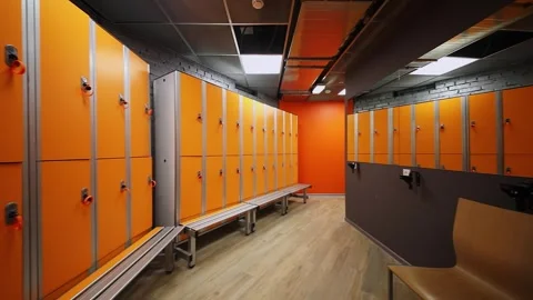 Row of lockers and mirror in dressing room of sports club Stock Footage 276367437
