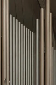 A row of long, thin, grey tubes Stock Photos