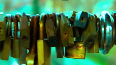Row of love locks attached to metal railing outdoors with soft focus Stock-Footage 341801523
