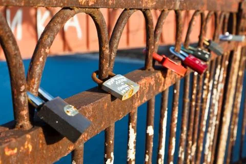 Row of love locks on the rusty bridge across volga river near samara, russia Stock Photos