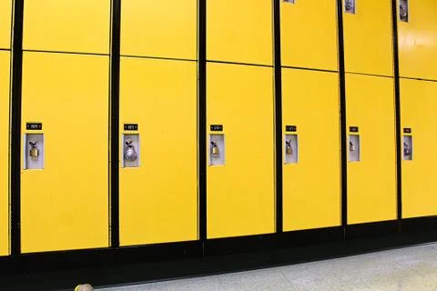 A row of lyellow ockers with locks on them Stock Photos