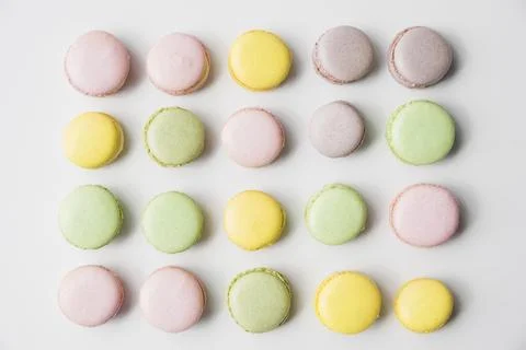 Row macaroons white backdrop Stock Photos