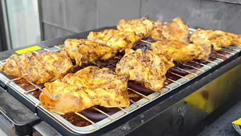 Row of Marinated Chicken Breast Grilling on Electric BBQ Grill Stock-Footage 344703843