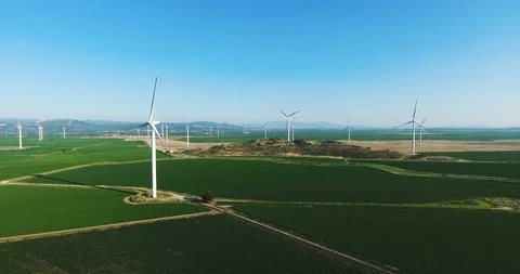 Row of modern wind turbines generating clean and renewable energy. 4k Stock Footage 97103257