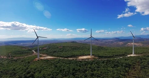 Row of modern wind turbines generating clean and renewable energy . 4k Stock Footage 97930022