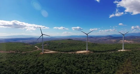 Row of modern wind turbines generating clean and renewable energy . 4k Stock Footage 97930186
