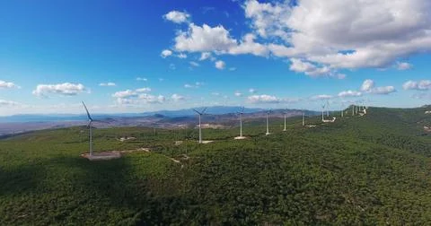 Row of modern wind turbines generating clean and renewable energy in the coun Stock Photos