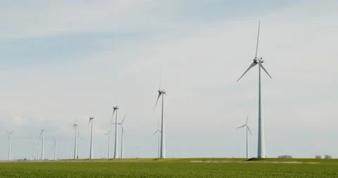 Row of modern windmills cloudy sky Stock Footage 189320244