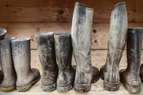 Row of muddy boots Stock Photos
