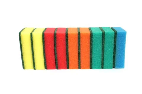 Row multi colored sponges for washing dishes isolated on white background Fotos de archivo