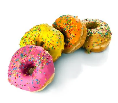 A row of multicolored donuts on a white background Foto stock