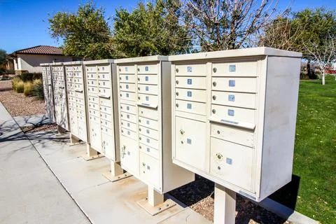 Row Of Multiple Mailboxes In Housing Subdivision Stock Photos