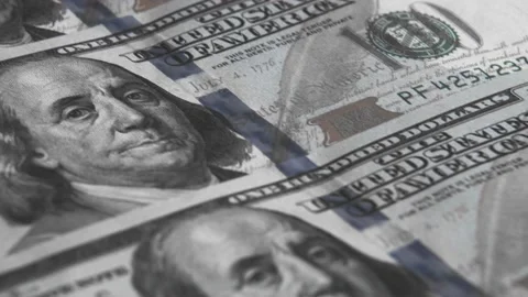 A row of new 100 US dollar bills moves diagonally from the top left corner. Back Stock Footage 232994069
