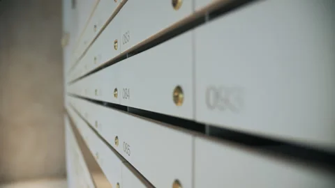 Row of numbered apartment mailboxes Stock Footage 311048414