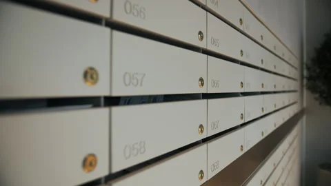 Row of numbered apartment mailboxes with keyholes Stock Footage 311278070