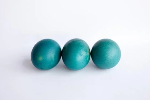Row of ombre blue Easter eggs isolated on white background Stock Photos