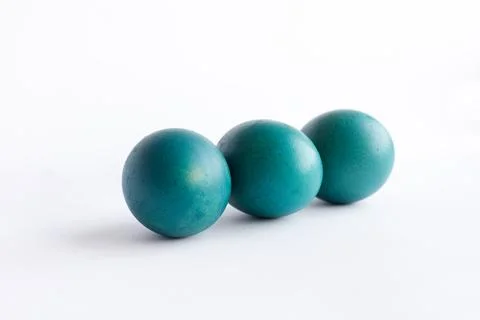 Row of ombre blue Easter eggs isolated on white background Stock Photos