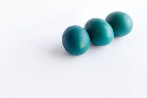 Row of ombre blue Easter eggs isolated on white background Stock Photos