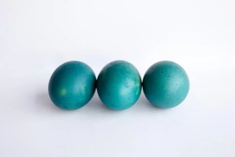 Row of ombre blue Easter eggs isolated on white background Stock Photos