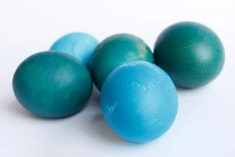 Row of ombre blue Easter eggs isolated on white background Stock Photos