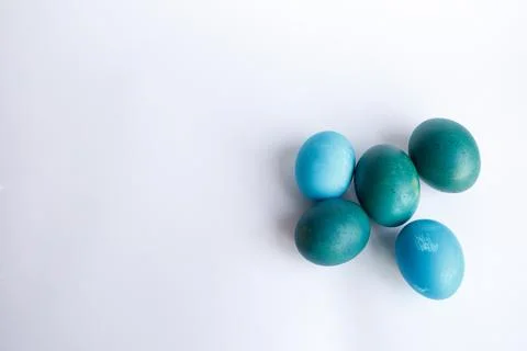 Row of ombre blue Easter eggs isolated on white background Stock Photos