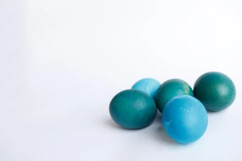 Row of ombre blue Easter eggs isolated on white background Stock Photos