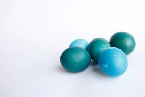 Row of ombre blue Easter eggs isolated on white background Stock Photos