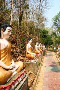 Row of orange Buddha statue, Sambok Pagoda Stock Photos